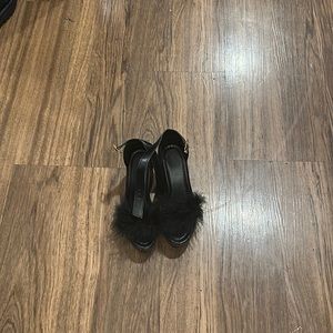 Selling these shoes cause they do not fit me they are black with fur and a size